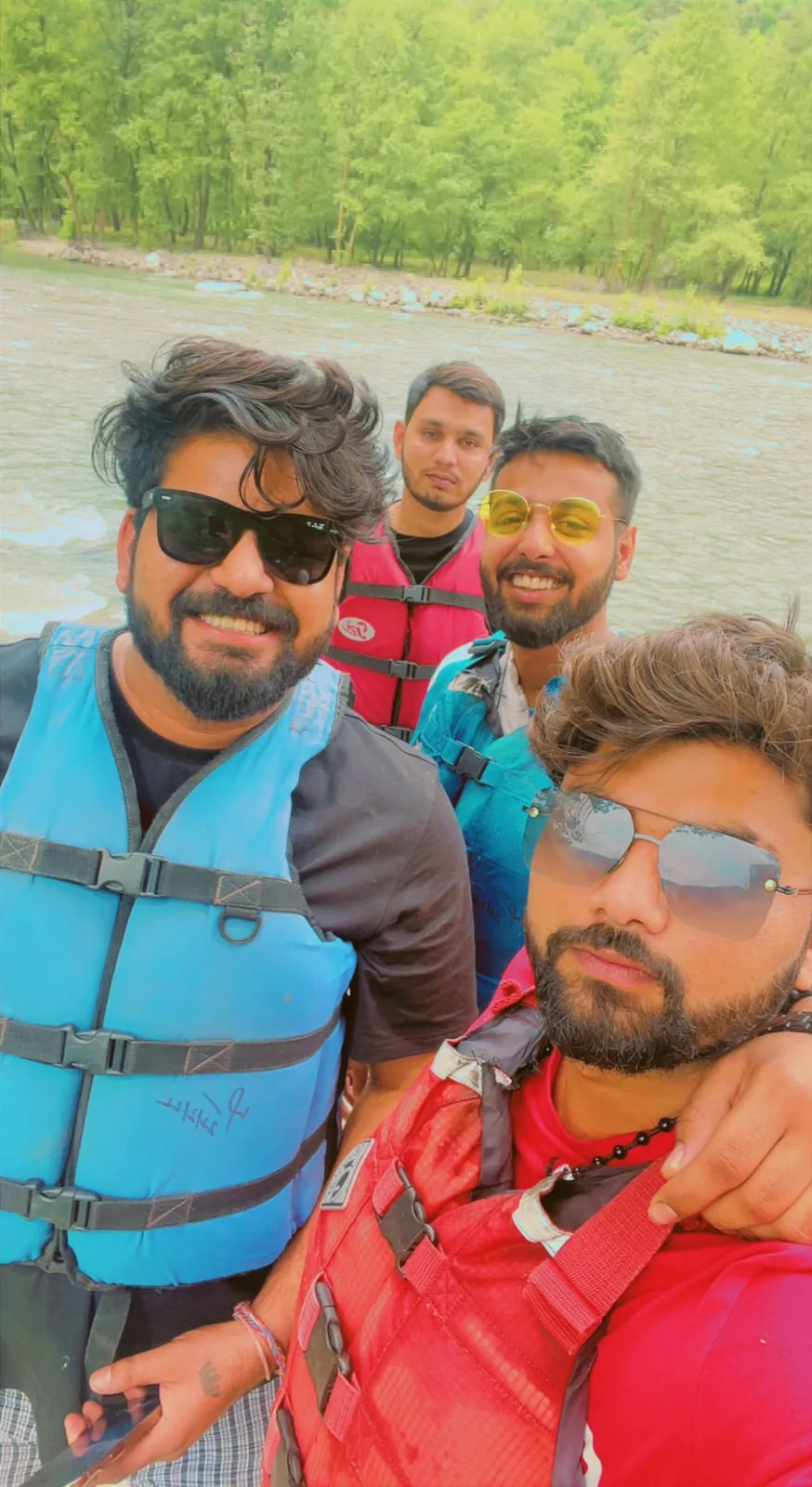 Travellers smiling in rafting gear