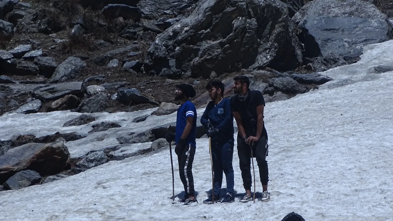 A small group together in a snowy mountain landscape