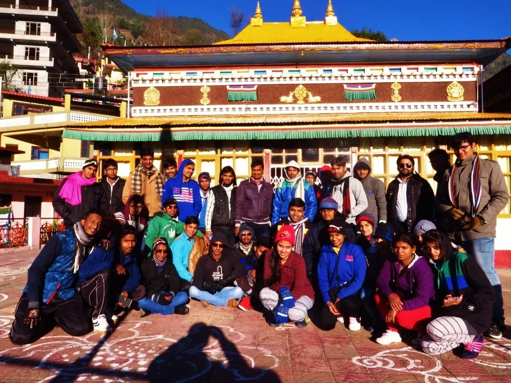 A group of travellers outside a Himalayan monastery